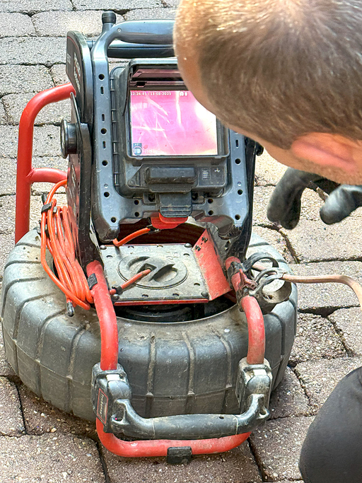 Sewer Inspection Camera Showing Pipe Interior On Screen